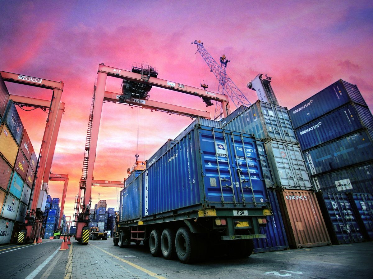 Truck carrying a container out of the port yard