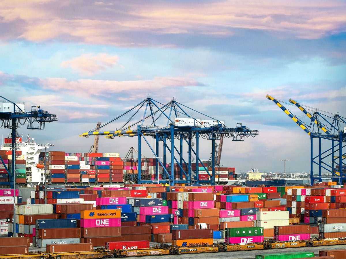 Gantry cranes loading a container ship at the port